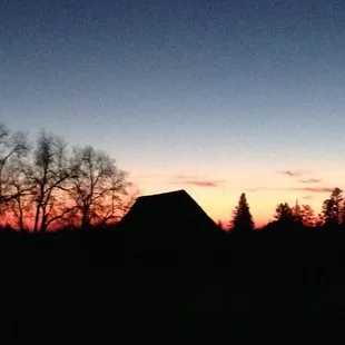 Sunset with a view of the signature barn on the property