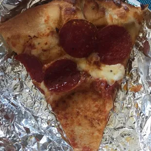 a slice of pepperoni pizza