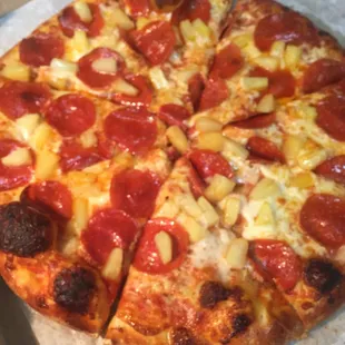 a pepperoni and pineapple pizza