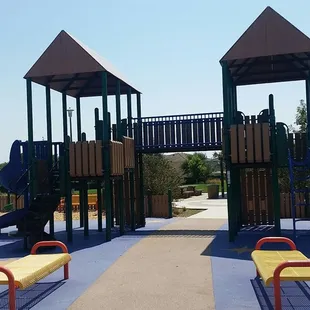 Climbing structures with slides