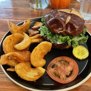 Black and blue burger with a side of fries