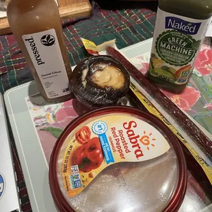 Hummus, pressed juice, baked juice, sausage sticks, cream cheese cupcake