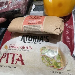 a bag of pita and a bag of whole grain pita