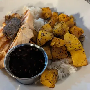 Salmon bowl with roasted squash and teriyaki sauce on the side