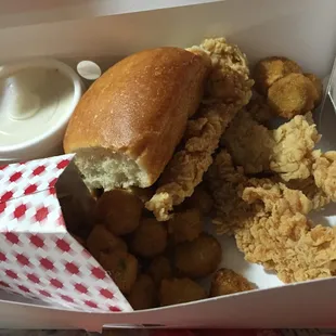 a chicken sandwich and fried tater tots