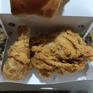a box of fried chicken and a roll