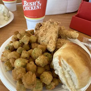 a plate of fried food and a cup of coffee