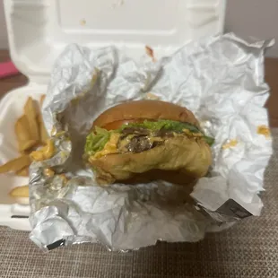 Traditional burger with American cheese and caramelized onions. Pattie is questionable. Sry, ate the fries they were delicious.