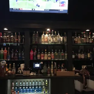 a bar with a large screen tv