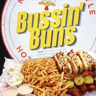 a plate of hot dogs and fries