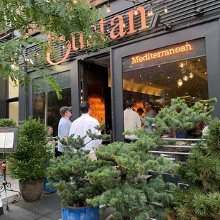 people sitting outside a restaurant