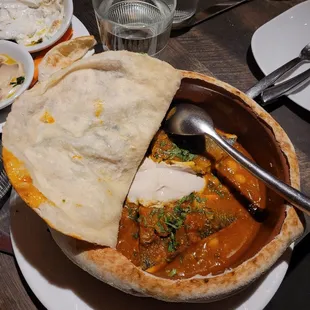 Moroccan Fish. Dorado, chickpeas, tahini, tomato sauce, cilantro in a taboon bread dome. A-MA-ZING!