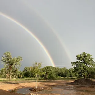 a double rainbow in the sky