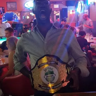 a man holding a belt