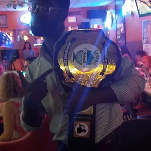a man holding a belt