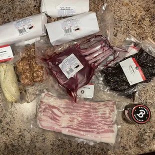 My haul of goodies.  House bacon, two kinds of sausage, meatballs, Saratoga steaks, Elk Ribeye, steak butter, seasoning, and beef jerky.