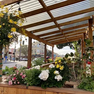 a covered area with flowers