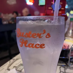 a glass of water with a straw