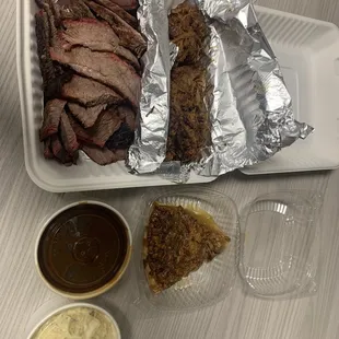 1 lb. of Brisket, half pound of Pulled Pork, potato salad, Pecan pie, original bbq sauce.