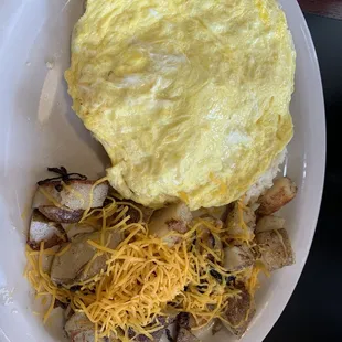 Scrambled egg biscuit with country potatoes. Typically smothered in sausage gravy but I asked for mine in the side. Delish.