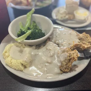 Chicken fried steak, mashed potatoes, and steamed broccoli