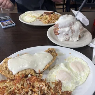 Chicken fried steak, hash browns, eggs, 1/2 cinnamon roll, sausage.   So delicious!