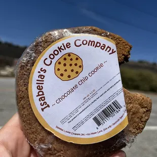 a hand holding a cookie