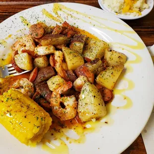 Bourbon Shrimp with corn, potatoes, smoked sausage, and yes an extra side of loaded mashed potatoes