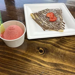  a chocolate crepe and strawberry ice cream