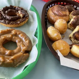 Glazed Donut Holes. eclair, and Cinnamon Roll assortment