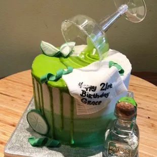 a birthday cake with a bottle of wine