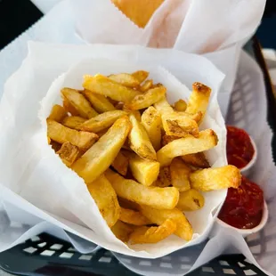 a basket of french fries and ketchup