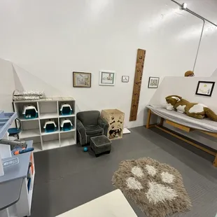 a room with a bed, a couch, and a desk