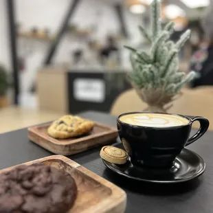 a cup of coffee and cookies