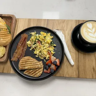 a plate of food and a cup of coffee