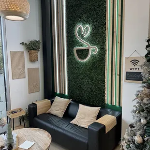 a coffee shop with a christmas tree in the background