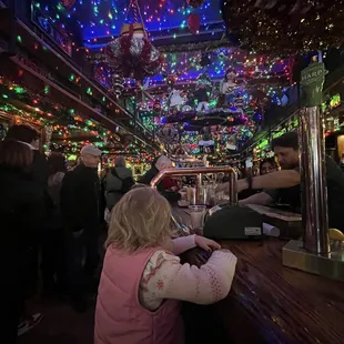 a little girl at the bar