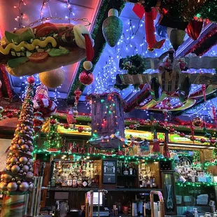 the interior of a restaurant decorated for christmas