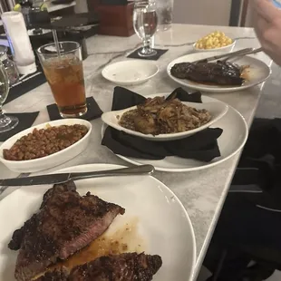 Ribeyes and a lot of sides.