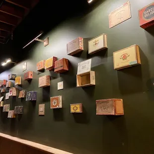 Love the cigar box wall