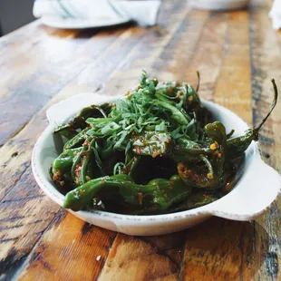 a bowl of green peppers
