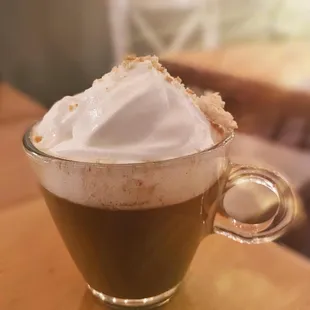 a cup of coffee with whipped cream