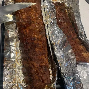 a person cutting a piece of meat