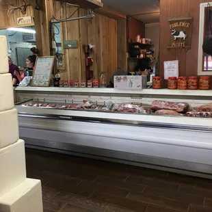 a butcher block with meat on display