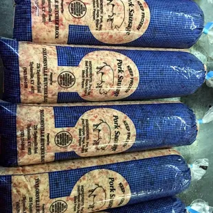 a stack of sausage wrapped in blue plastic