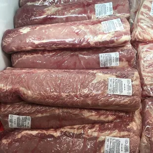 a variety of meat wrapped in plastic