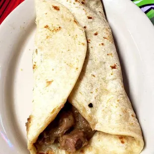 BB's Famous "Super Taco!" Bean and carne guisada con tortilla harina sin queso.