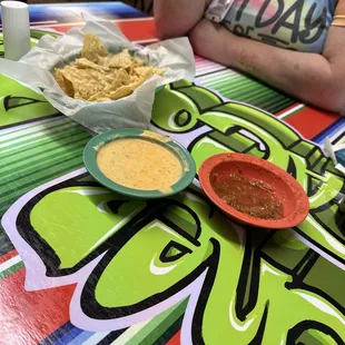Chips salsa, and queso.