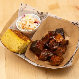 Burnt ends with coleslaw and corn bread
