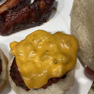 a plate of hamburgers and bacon